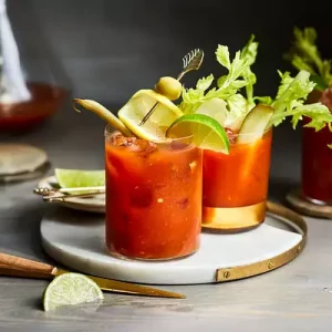 bloody-mary cocktail in 2 glasses - it has red color made from tomato juice and vodka