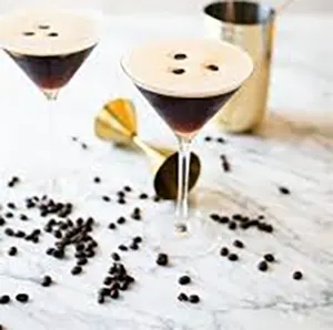 An Espresso Martini cocktail with a coffee bean on top