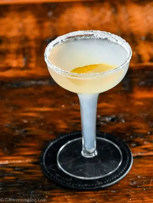 A Lemon Drop cocktail with a lemon twist