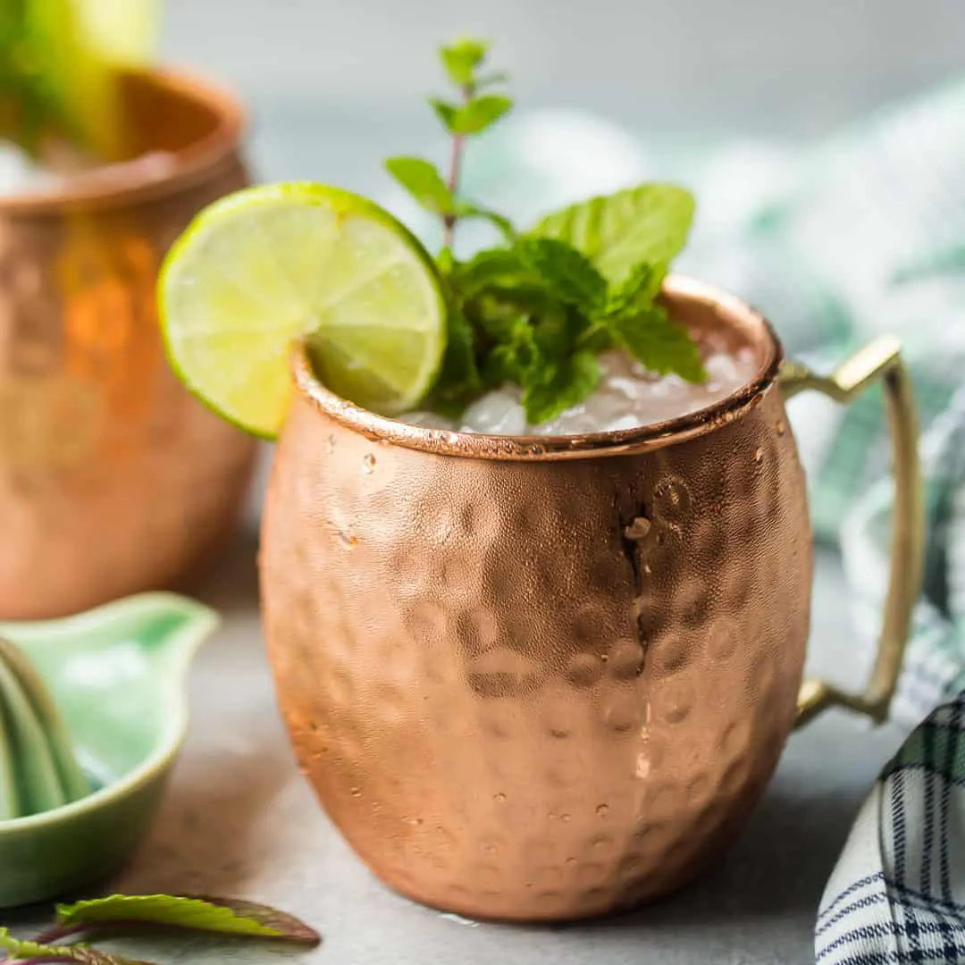 A Moscow Mule cocktail in a copper mug